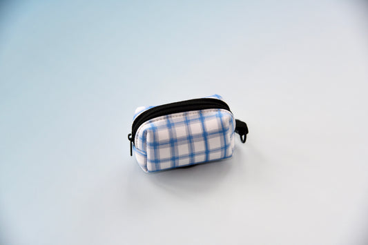 Small blue and white checkered pouch on a light blue background