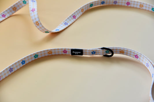 Dog collar with floral pattern on a beige background