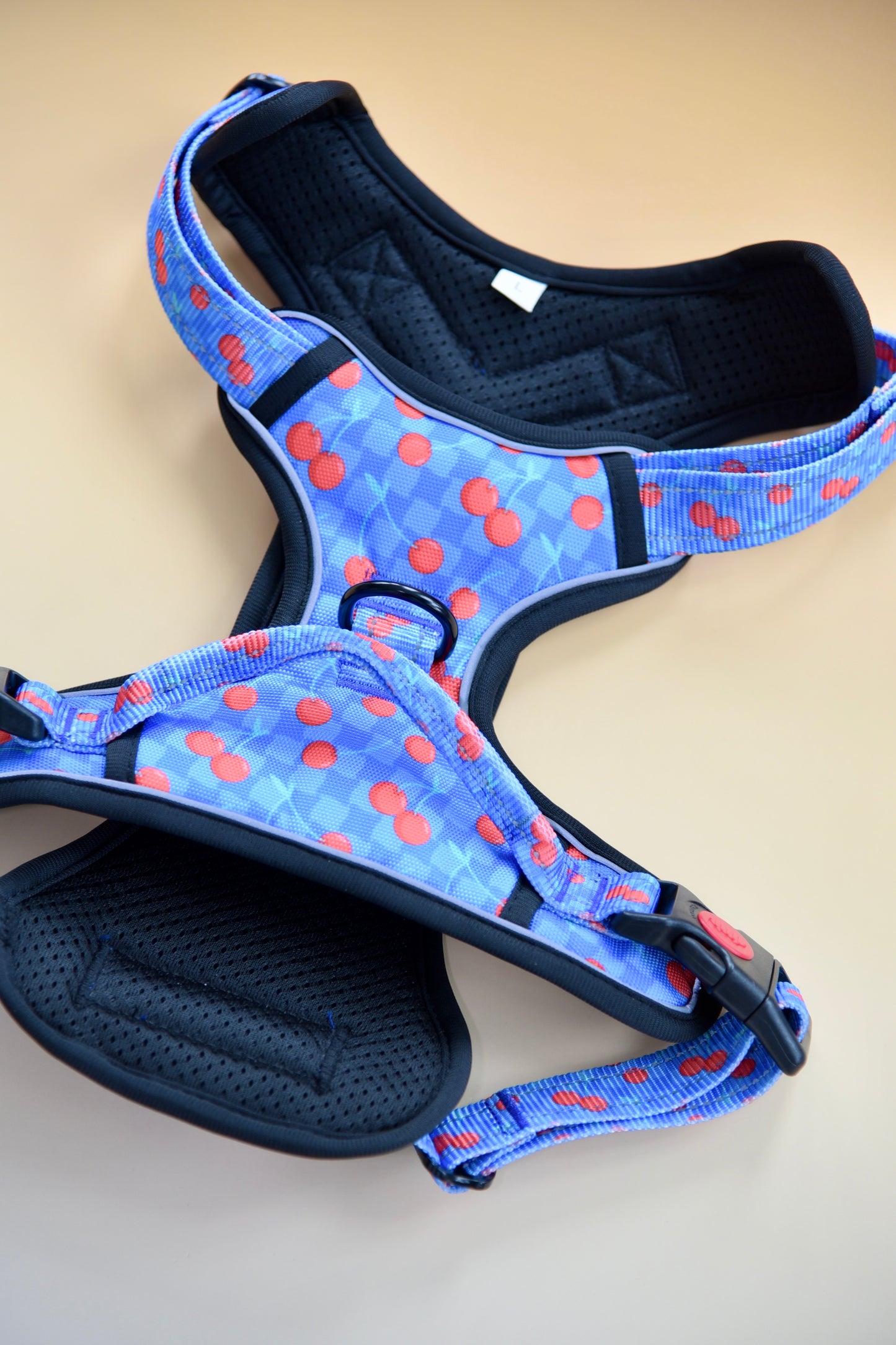 Adjustable dog harness with metal buckles and reflective stitching"