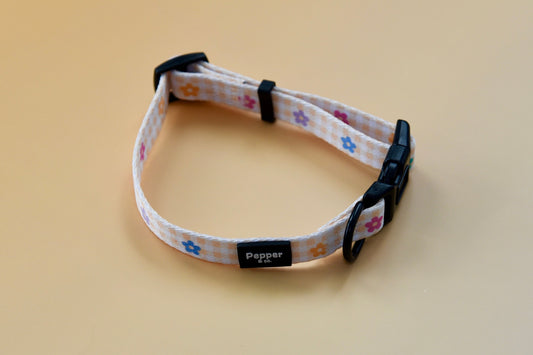 Dog collar with floral pattern on a beige background